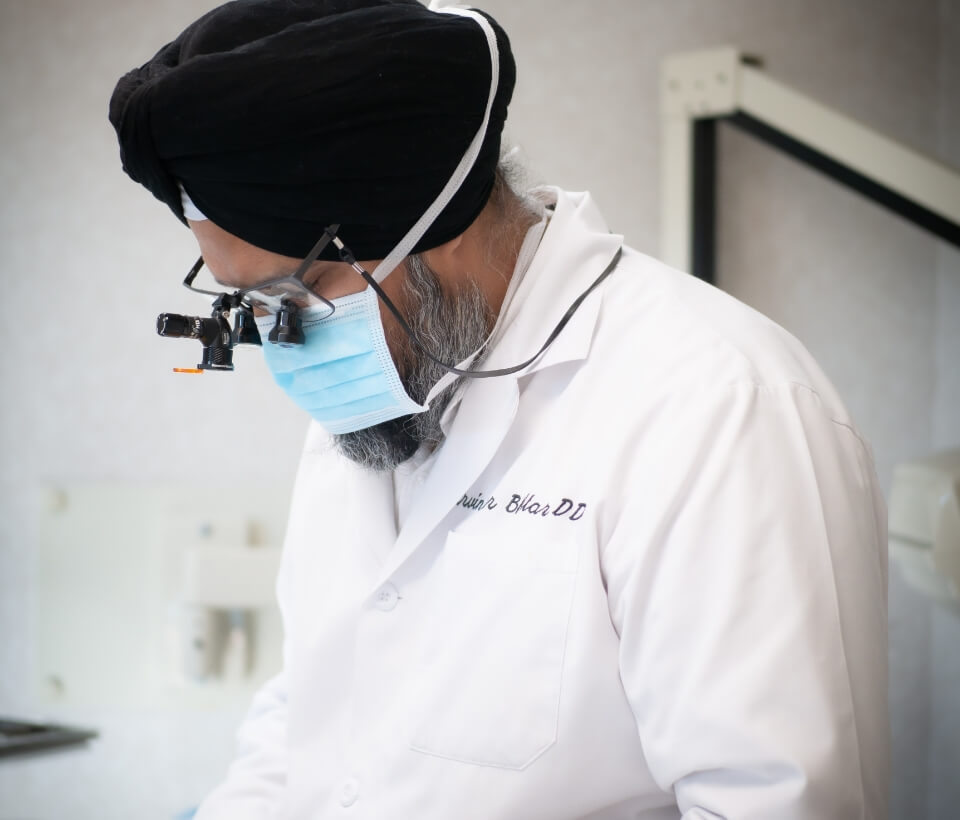 Dr. Bhullar during a dental procedure