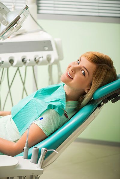 patient smiling while in the dental chair at Napa Valley Dental Group