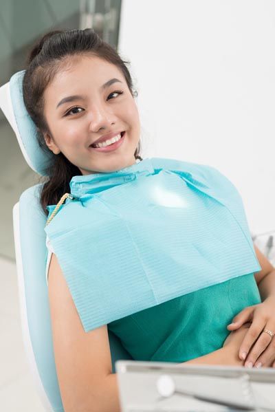 patient smiling while receiving dental services from Napa Valley Dental Group