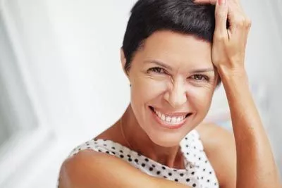 woman smiling after getting new dentures from Napa Valley Dental Group