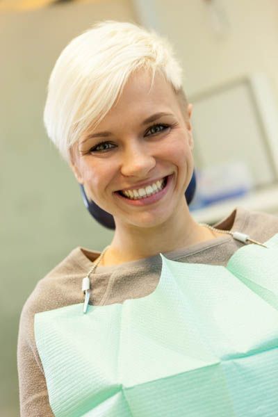 woman showing off her clean smile after a checkup at Napa Valley Dental Group
